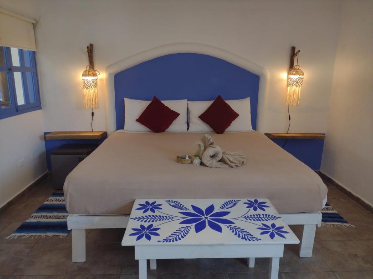 Mio Tulum Hotel Boutique Exterior photo A bedroom in a hotel in Santorini, Greece